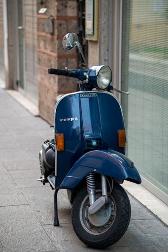 Terni, Italy, October 10, 2020: A vespa piaggio 125 vintage motorcycle in blue color
