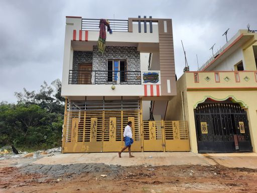 The beautiful new multi-floor building constructed in the village with nature background