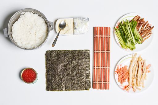 A top view shot of the ingredients to make sushi rolls