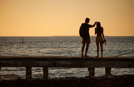 Silhouette Loving couple by the sea at sunset in Bayahibe, Dominican Republic