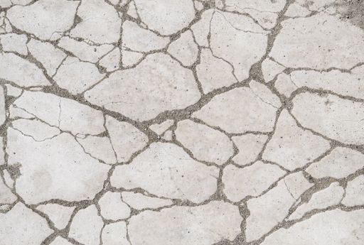 The closeup shot of the cracked concrete texture - perfect for background