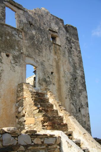 A vertical shot of old ruins on the island of Mykonos in Greece