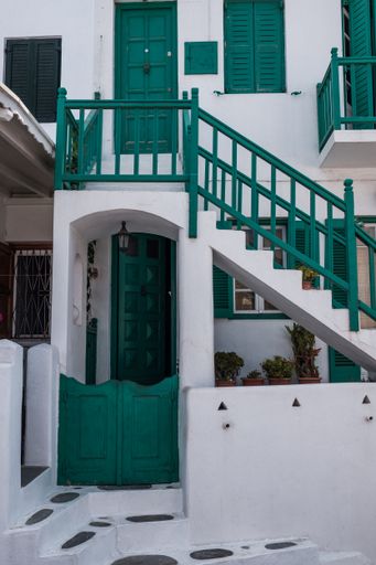 A vertical shot of a white-green building facade