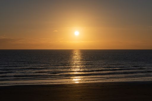 A closeup of a Sunset at Traeth beach, Llanddwyn, Wales