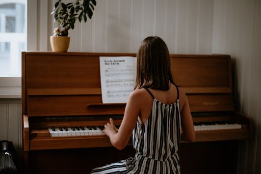 A selective of a female playing piano