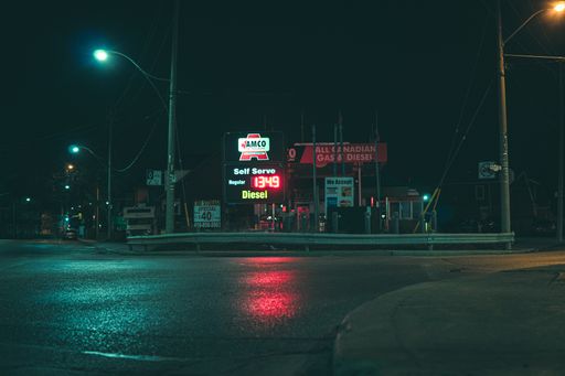 A closeup of a Moody Gas Station at night