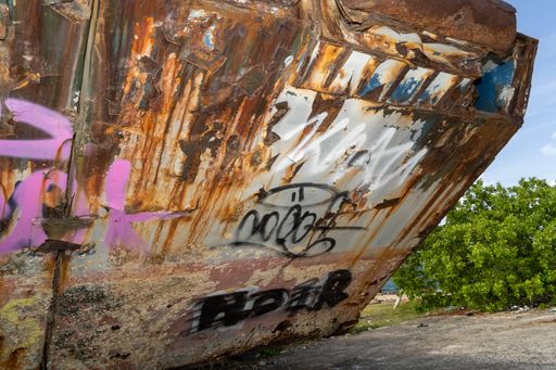 An old rusty ship with graffitis in an abandoned shipyard in La Puntilla in Catano, Puerto RicoCatano