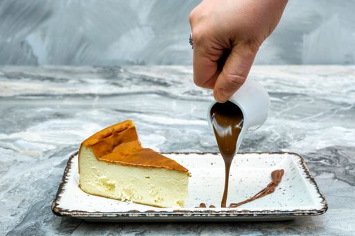 A closeup shot of the San Sebastian Cheesecake on a marble floor