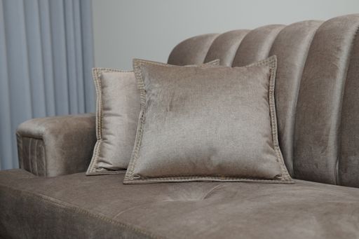 A closeup shot of a decorative beige pillows