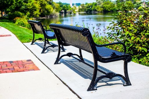 A closeup of modern benches near the lake