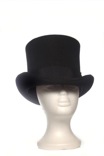 A vertical shot of the vintage top hat on mannequin head isolated on the white background