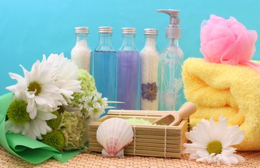 A beautiful closeup shot of Cosmetics and Spa Products on Bamboo With Towel Bath Products