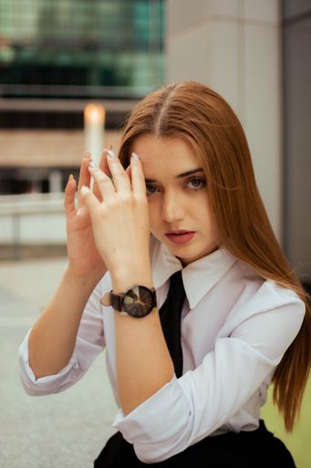 A vertical shot of the attractive young blonde girl posing for the camera