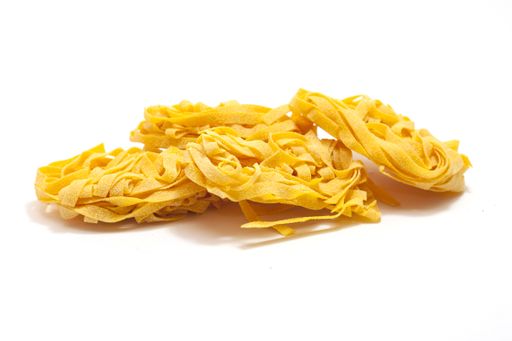 A closeup shot of Italian egg pasta rolled on a white isolated background