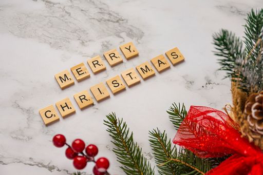 A tChristmas decoration with lettered wooden tiles forming the words Merry Christmas