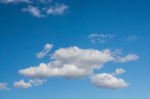A view of a Cumulus cloud in the clear blue sky captured on a sunny day