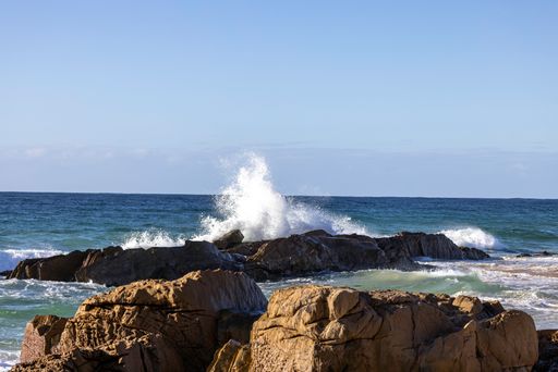 A beautiful seascape with waves crashing on a rocky shore