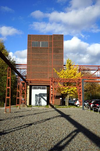 A vertical shot of open ground above an old steel construction with rusty pipes