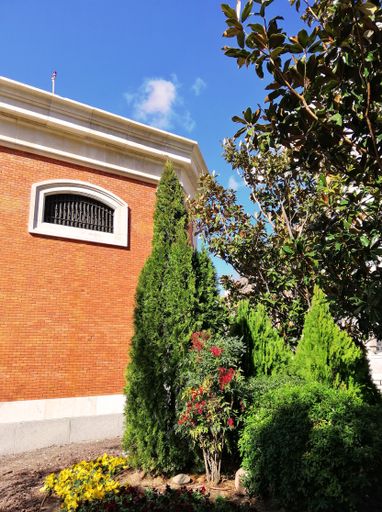 A vertical shot of the brick building in Parque Santander, Madrid, Spain