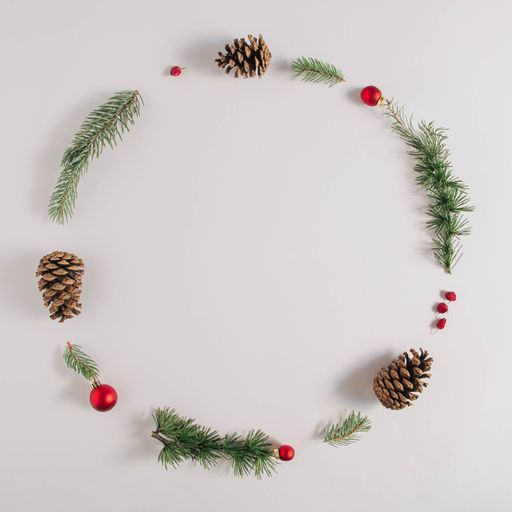 A closeup of a Christmas round frame on a white background
