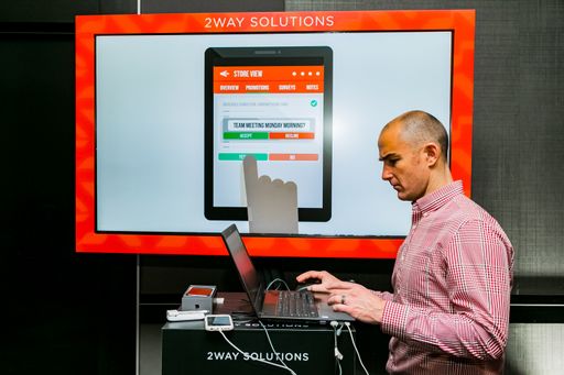 The Vendors demonstrating a product service at retail industry conference Johannesburg, South Africa