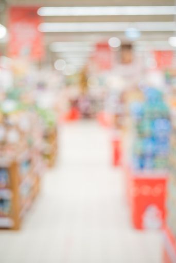 A vertical shot of a blurred store interior. Soft focus background for an inscription.