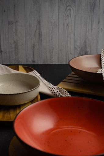 A vertical shot of an arranged table with empty bowls