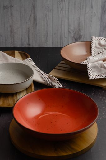 A vertical shot of an arranged table with empty bowls