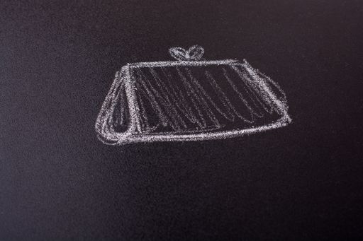 A closeup shot of a  wallet drawn on a blackboard with chalk