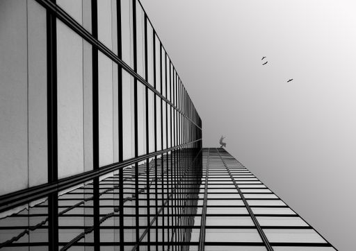 A low angle shot of a modern glass building
