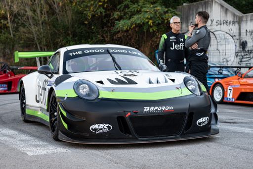 A Porsche 911 GT3 R in the Rally hill climb in Sant Feliu Codines, and people in the background