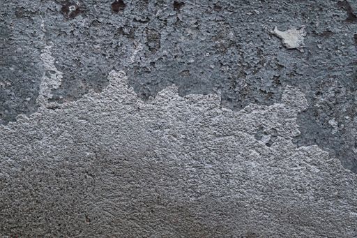 A closeup shot of the cracked oncrete wall texture