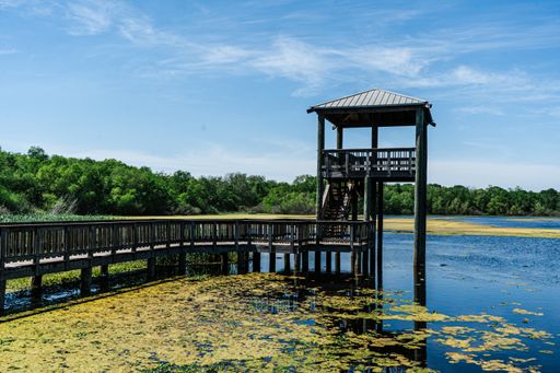 A view of gazebo in the lake under the blue sky