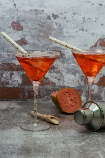 refreshing squeezed guava cocktail with ice and cocktail shaker