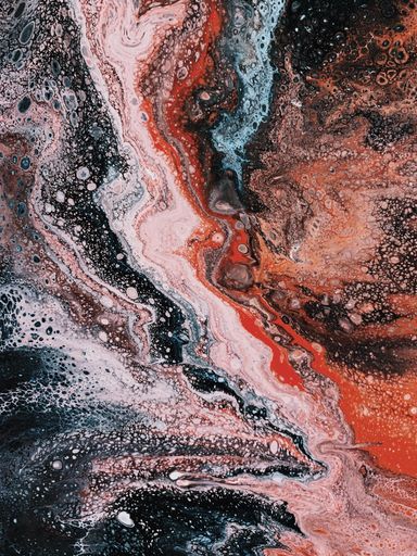 A vertical shot of a patterned surface of blue red black white colors - perfect for background