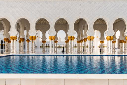 Visitors at the Sheikh Zayed Grand Mosque in the capital city of Abu Dhabi, United Arab Emirates. It is the largest mosque in the UAE