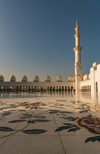 Visitors at the Sheikh Zayed Grand Mosque in the capital city of Abu Dhabi, United Arab Emirates. It is the largest mosque in the UAE