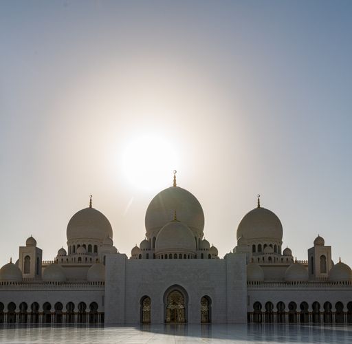 Visitors at the Sheikh Zayed Grand Mosque in the capital city of Abu Dhabi, United Arab Emirates. It is the largest mosque in the UAE
