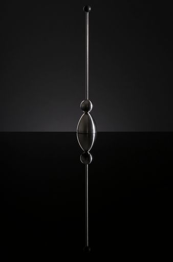 A closeup of a hanging lamp on a gray background