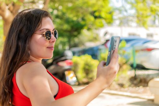 A woman taking a selfie or video calling.