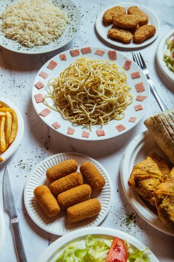 A variety of dishes on the table of fast food restaurant