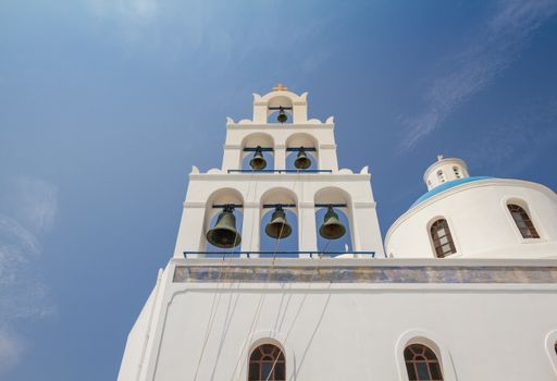 The iconic blue dome church in the island of Santorini in Greece