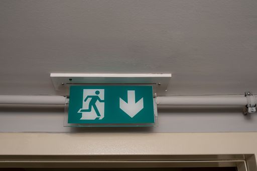 An emergency exit sign on the door