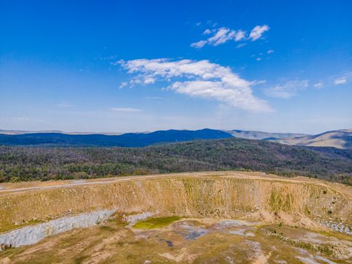 Aerial View at Copeton Dam Waters with the mountains and beautiful blue sky in Australia