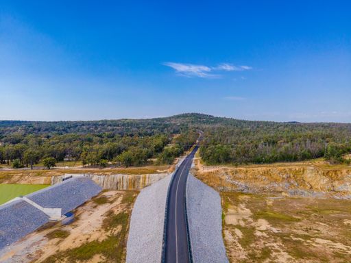 The aerial view of the highway under the sky at Copeton Dam Waters out near Inverell, Australia