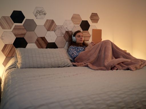 A closeup of a young girl spending her leisure time in the room