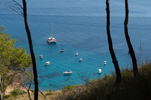 An aerial view of boats on the blue sea near Mallorca, Spain