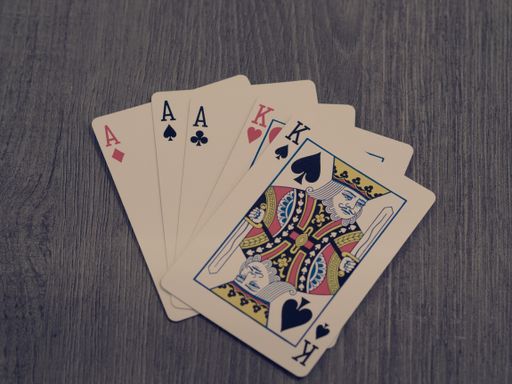 The poker cards on the wooden table