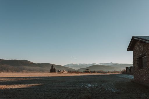 The clear blue sky over La Cerdanya, Catalunya, Spain with snowy mountains on the background
