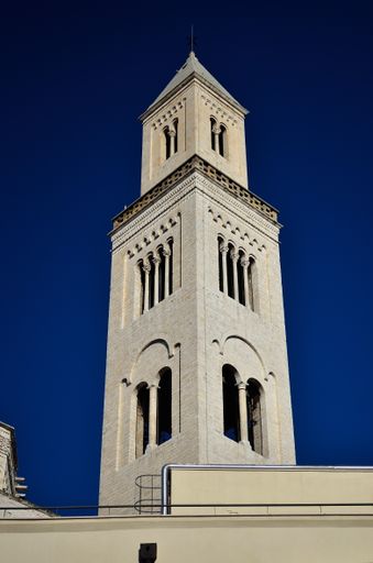 A vertical shot of a tower of Bari Cathedral in southern Italy under the clear sky